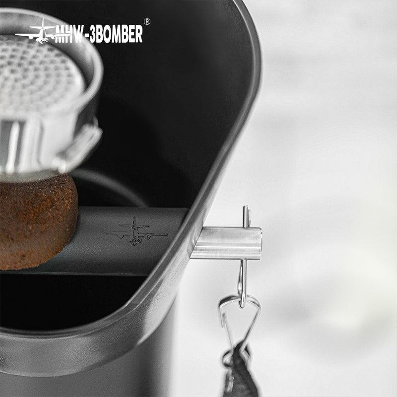 GB5449 upper rim, knock bar and towel hook beside a portafilter