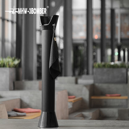 Full black GB5449 standing bin beside a window and coffee table
