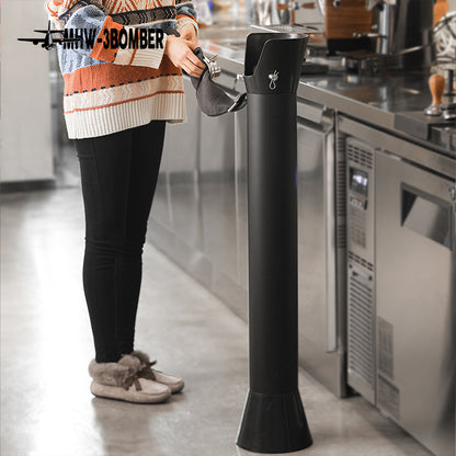 Full GB5449 standing bin beside an espresso counter during portafilter wiping