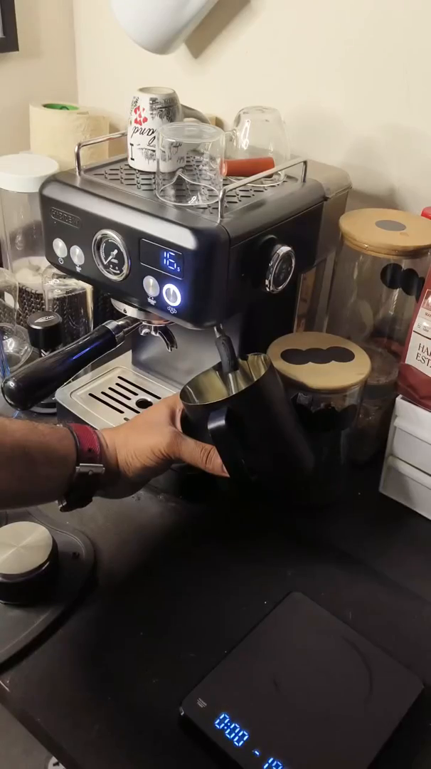 HiBREW H10A black espresso machine during coffee preparation