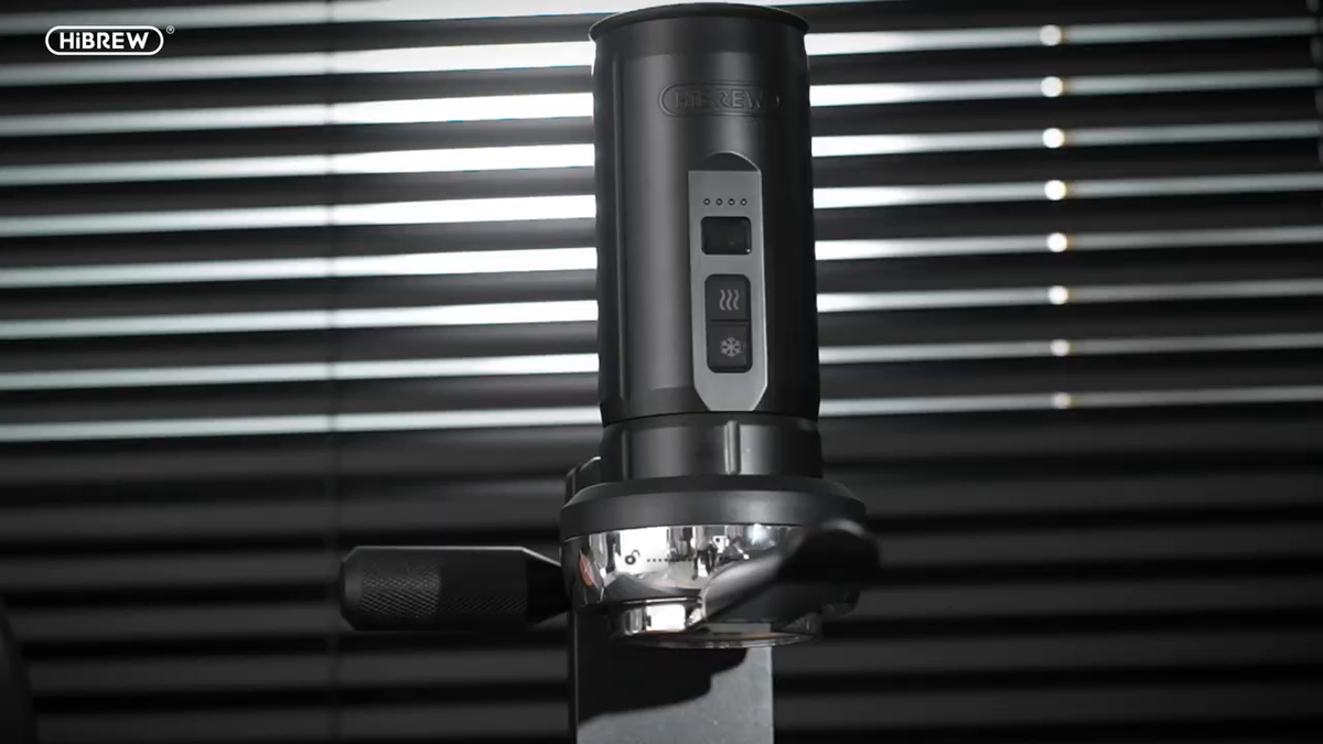 HiBREW H4C Max portable espresso unit on its 58 mm metal base station.