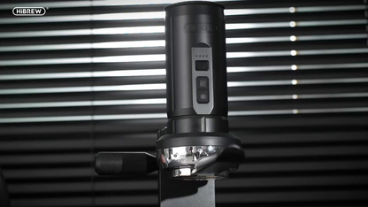 HiBREW H4C Max portable espresso unit on its 58 mm metal base station.