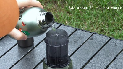 Green HiBREW H4D being filled with externally heated water; kettle not included