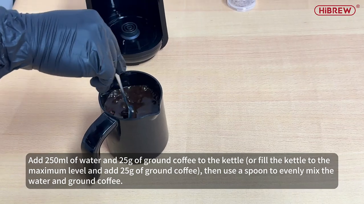 HiBREW H9 — mixing ground coffee and water in the pot