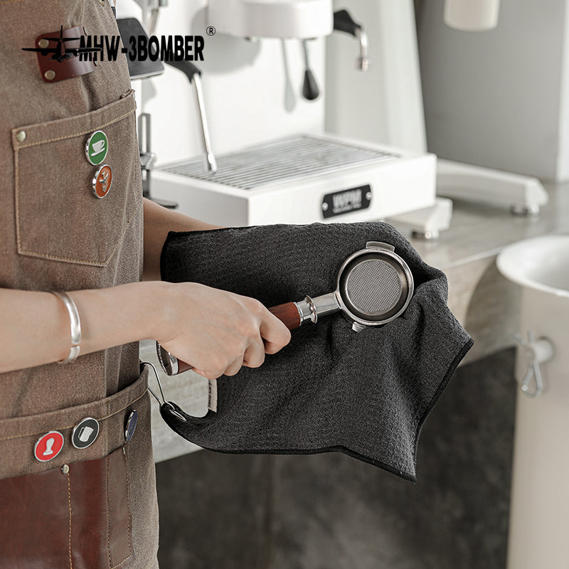 MHW-3BOMBER black hangable towel used to wipe a portafilter