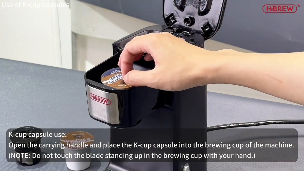 HiBREW 507 loading a K-Cup into the brew holder