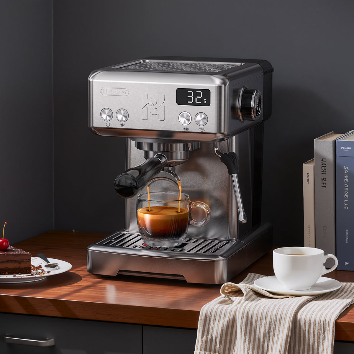 HiBREW H10 stainless-steel espresso machine extracting coffee on a dark wooden counter; scene props not included