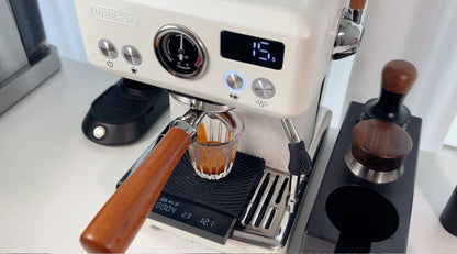 HiBREW H10Plus extracting espresso; cup and coffee scale not included