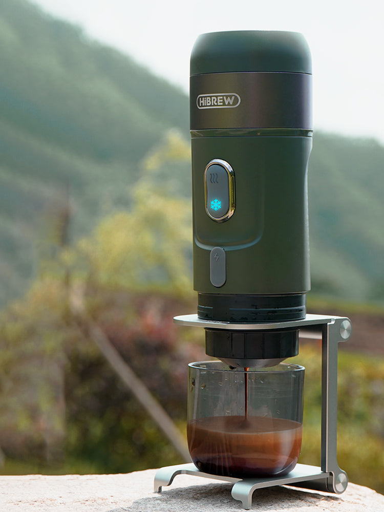 Green HiBREW H4B outdoors on its folding brewing support