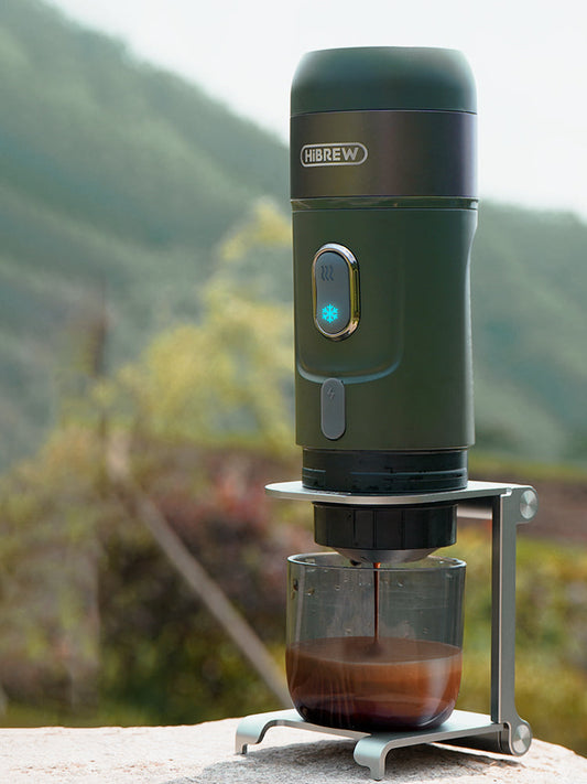 Green HiBREW H4B outdoors on its folding brewing support