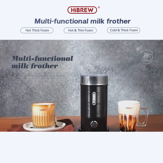 HiBREW M1A black milk frother on a table with hot and cold drinks