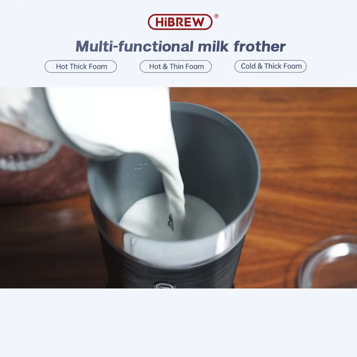 HiBREW M1A black milk frother with milk being poured into the jug