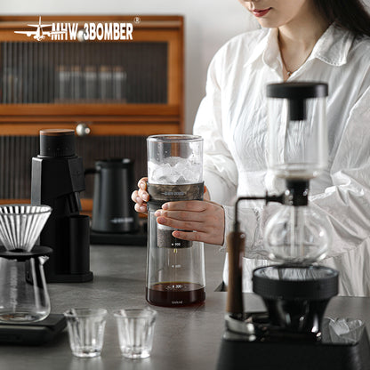 MHW-3BOMBER ID5900 complete stacked brewer held in a coffee-workspace scene; other equipment and scene props are not included