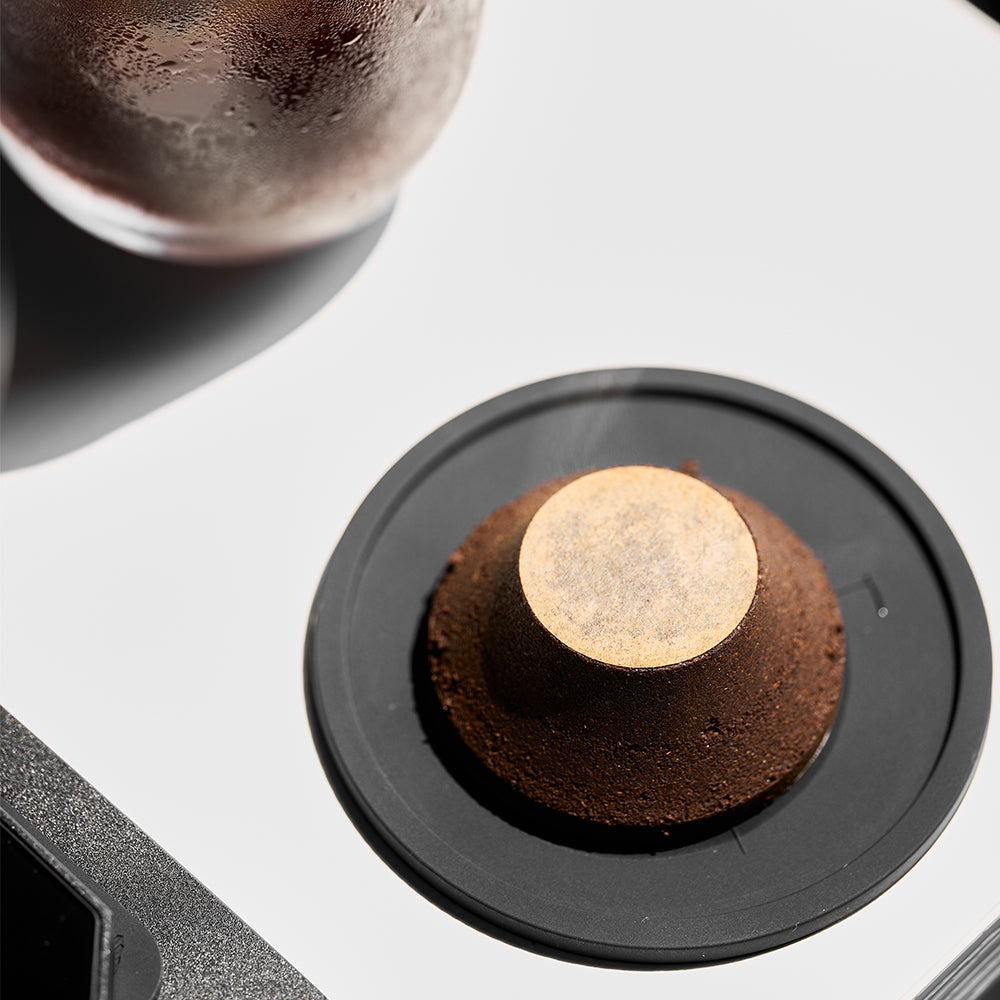 32 mm paper filter on a used espresso puck after extraction