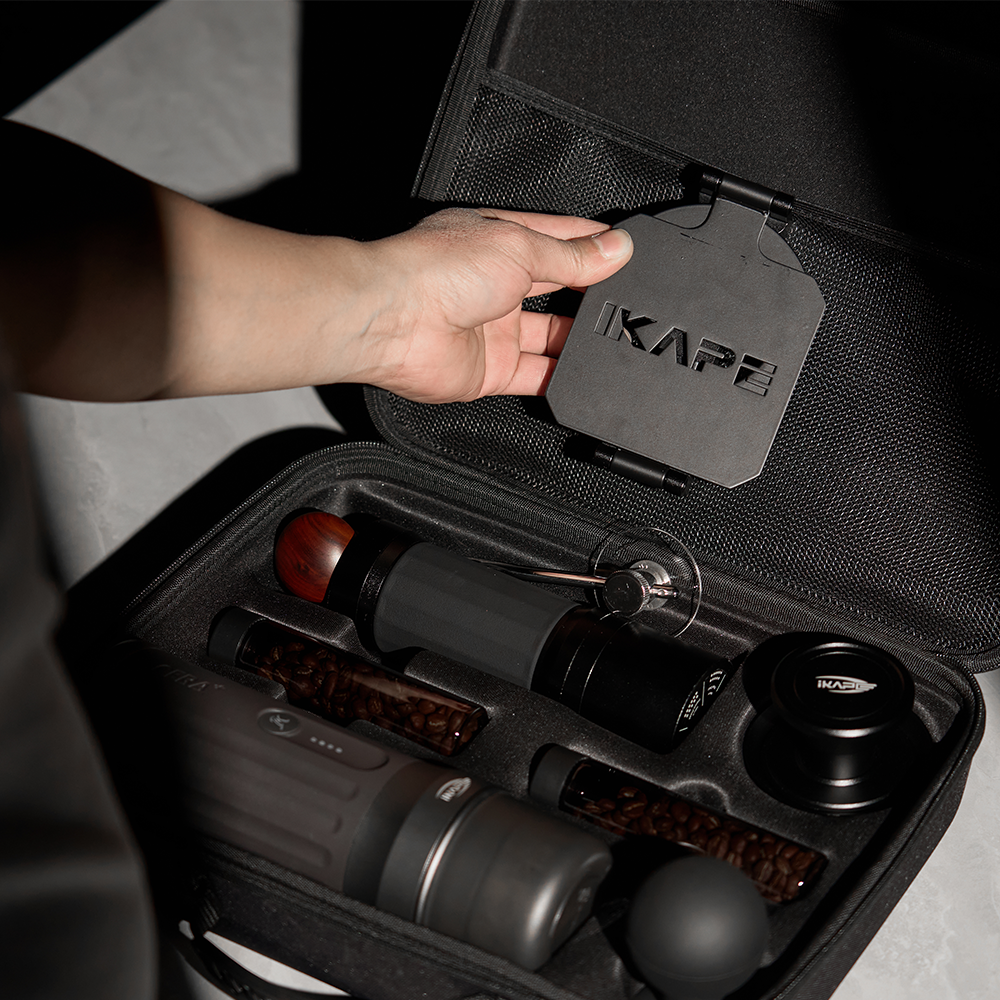 IKAPE carrying bag, hand demonstrating the upper mesh pocket