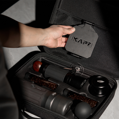 IKAPE carrying bag, hand demonstrating the upper mesh pocket