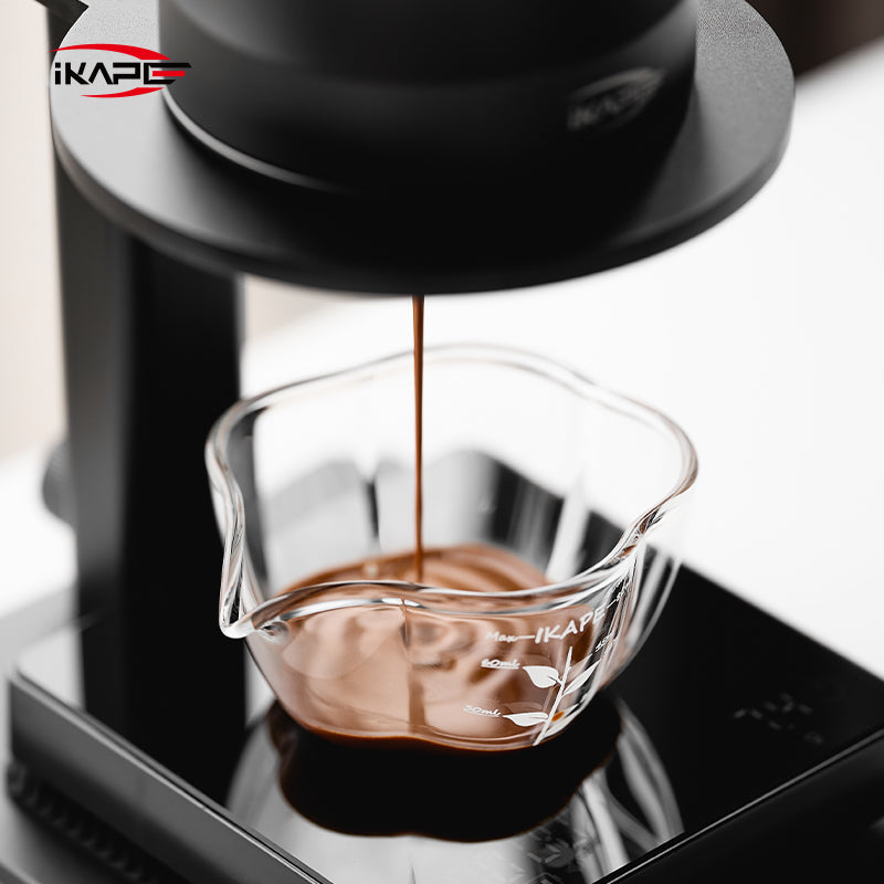 IKAPE Glass Petal measuring cup, close view of espresso extraction