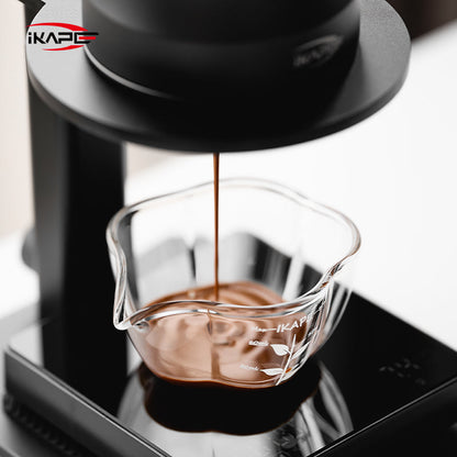 IKAPE Glass Petal measuring cup, close view of espresso extraction