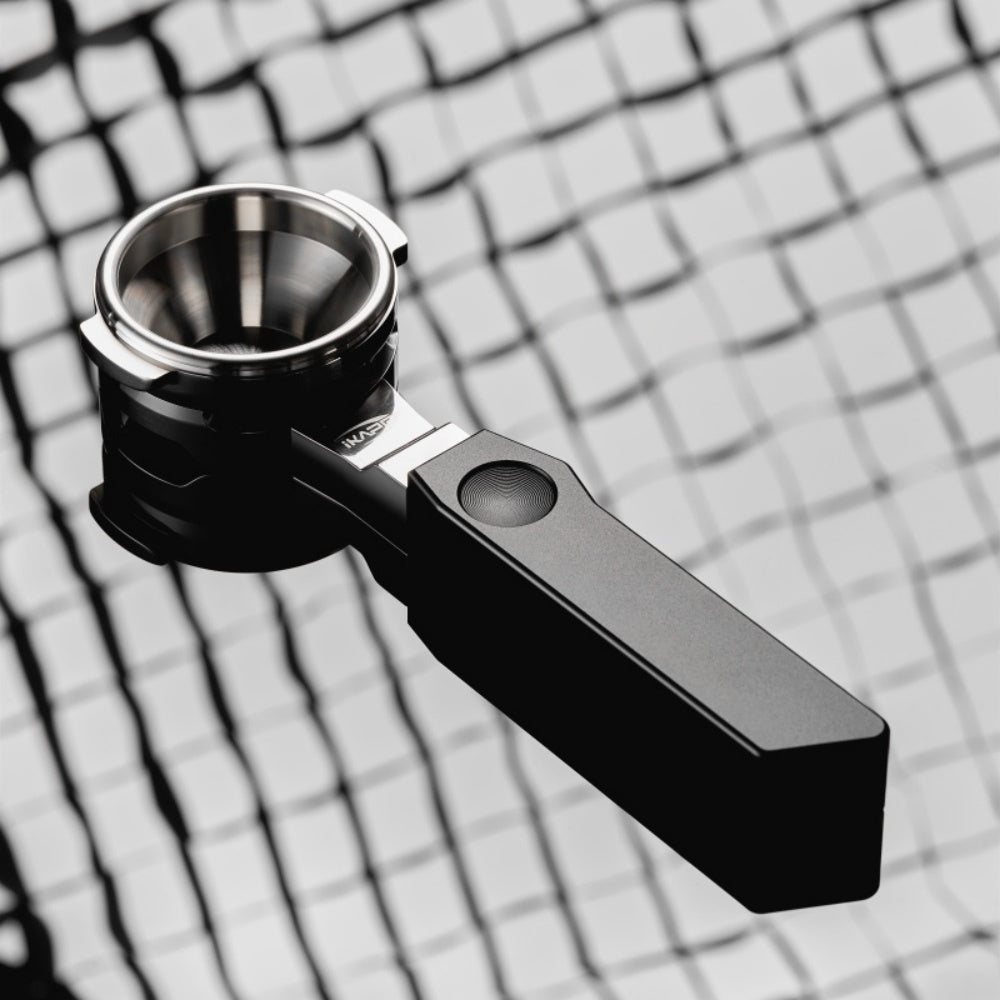 IKAPE Polaris black 58mm dual-ear flat-base bottomless portafilter; manufacturer scene 2; other equipment not included