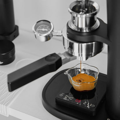 IKAPE Polaris black 58mm dual-ear flat-base bottomless portafilter; manufacturer scene 9; other equipment not included
