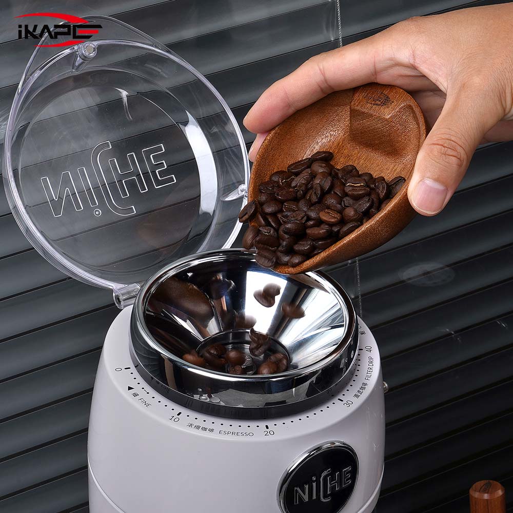 IKAPE walnut bean bowl pouring coffee beans; shared bowl component, spray bottle not shown