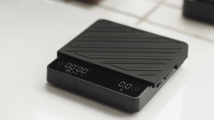 IKAPE SC35 black coffee scale — full scale with silicone mat on counter. Brewing tools, cups and appliances are not included.