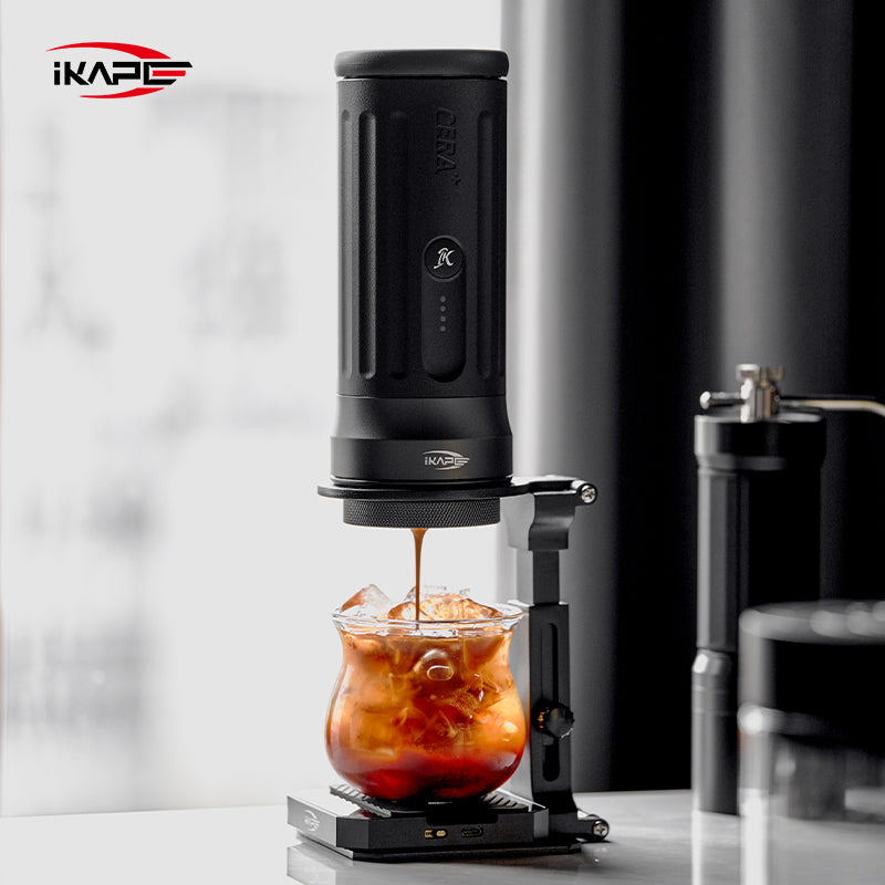 IKAPE folding stand holding a portable espresso maker during extraction