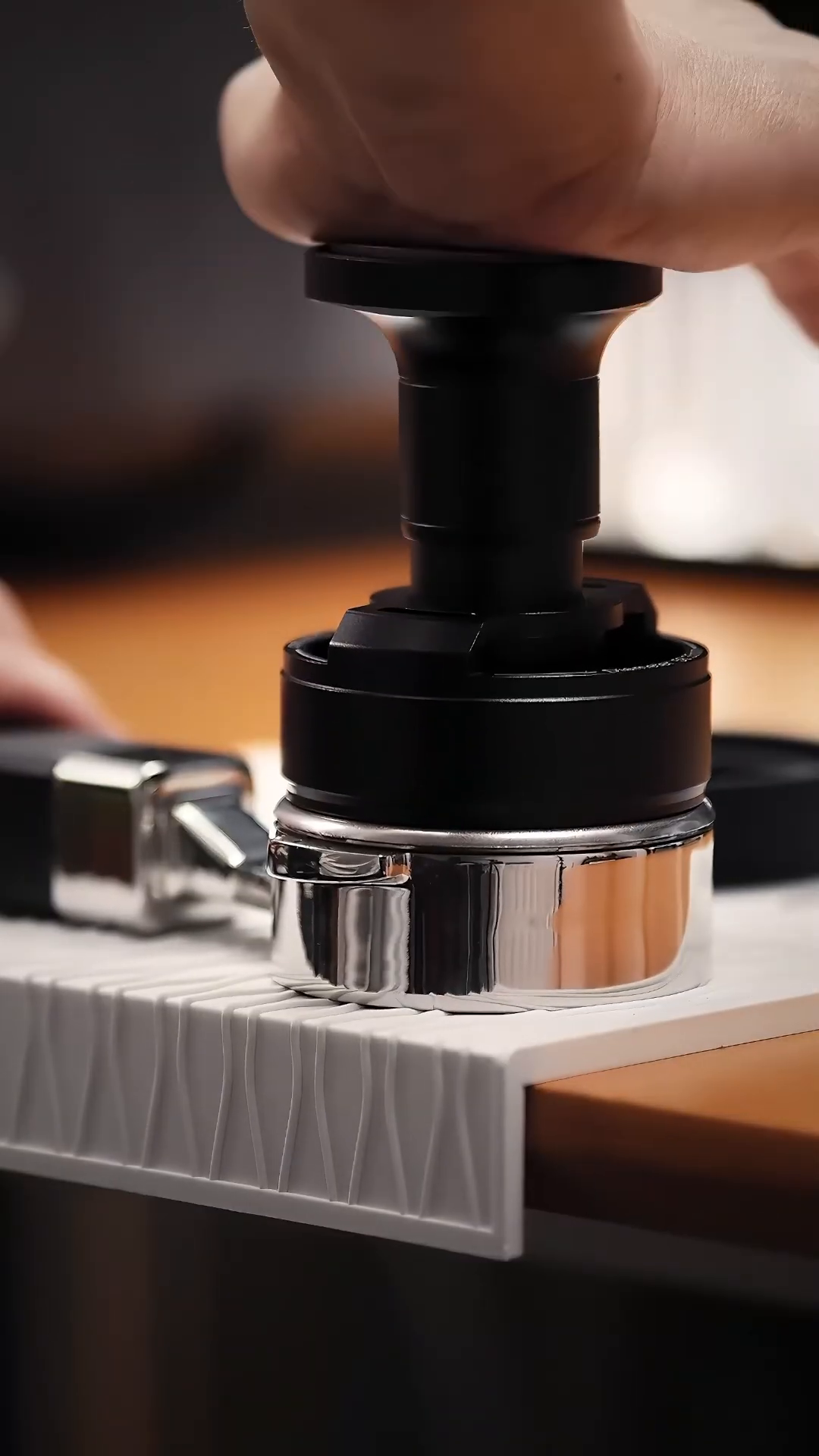 Using the IKAPE UniPress 58.35 mm on an espresso basket; portafilter and counter mat sold separately.