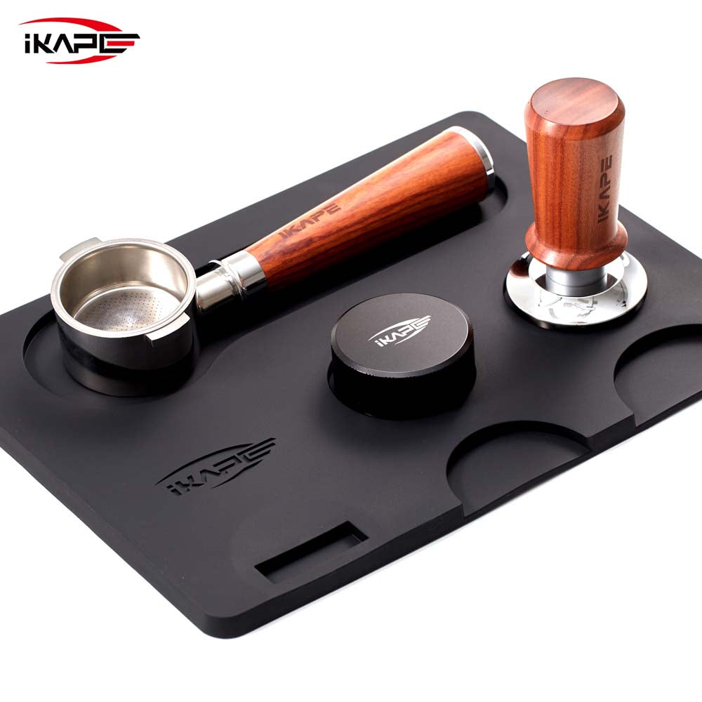 IKAPE V1 black silicone tamping mat with recessed tool storage; tools shown are props and not included