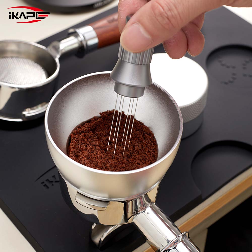 IKAPE V1 black silicone tamping mat during WDT preparation; tools shown are props and not included