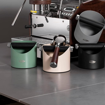 IKAPE V1 black metal espresso knock box on a coffee counter
