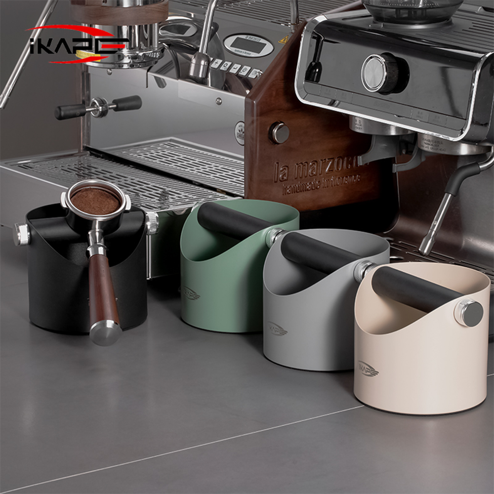 IKAPE V1 black metal espresso knock box beside espresso equipment
