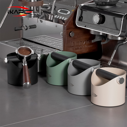 IKAPE V1 black metal espresso knock box beside espresso equipment