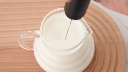CLITON KJBQ-65 Black frother mixing milk in a glass pitcher