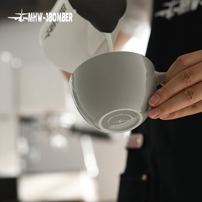 MHW-3BOMBER Mars Pencil grey cup tilted during milk pouring