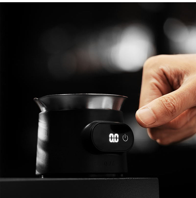 MHW-3BOMBER ES8031 black ESP coffee scale — hand operating the scale