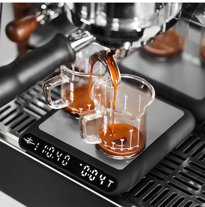 MHW-3BOMBER ES5485W white Formula coffee scale — double-spout espresso scene