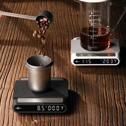 MHW-3BOMBER ES5485W white Formula coffee scale behind the listed black variant — coffee and server styling scene
