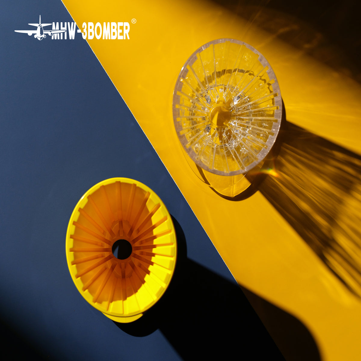 MHW-3BOMBER FC6605;FC6606Y — clear and yellow Oval drippers showing different interior views; other tools are scene props