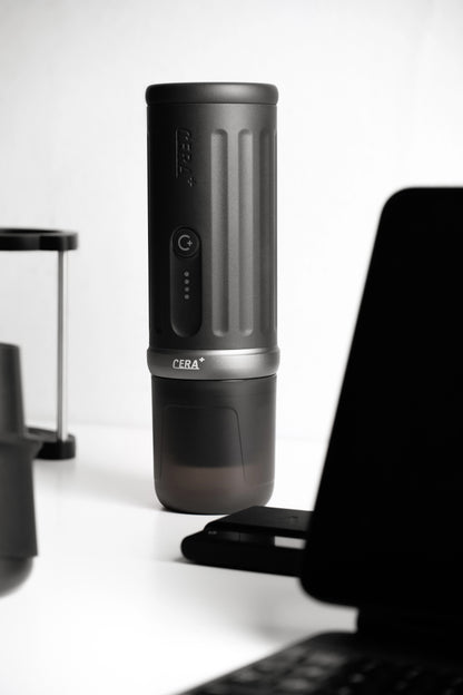 CERA+ PCM03S Space Grey espresso machine with attached cup on a desk