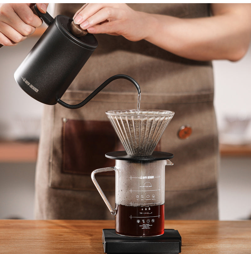 MHW-3BOMBER black cylindrical Planet kettle pouring into a dripper