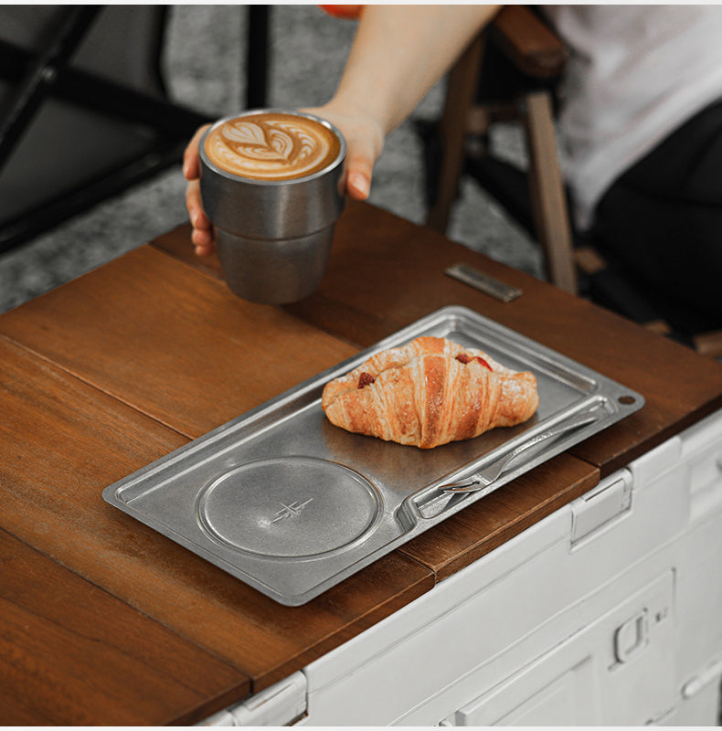 MHW-3BOMBER S5983SS silver tray on a countertop as a coffee cup is lifted