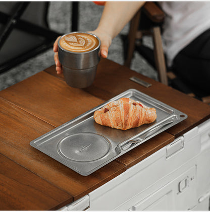 MHW-3BOMBER S5983SS silver tray on a countertop as a coffee cup is lifted