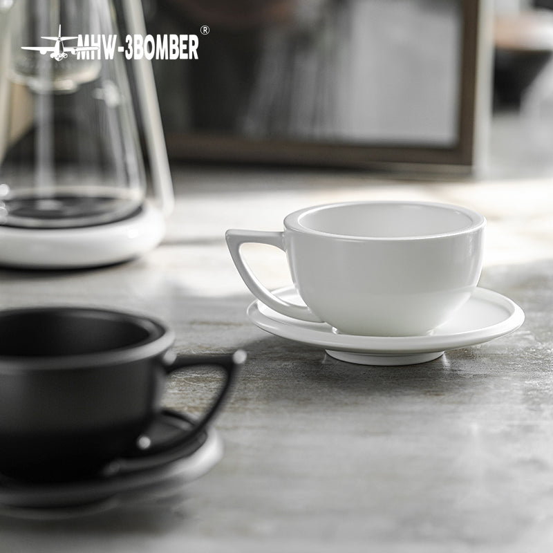 MHW-3BOMBER Sawada — 280 ml Mineral White empty cup and saucer on a stone counter; drinks, decoration and other tools are scene props