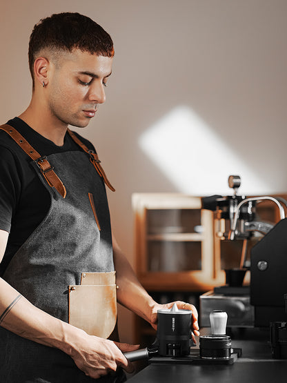 MHW-3BOMBER barista using a black SE Pro shaker with a portafilter