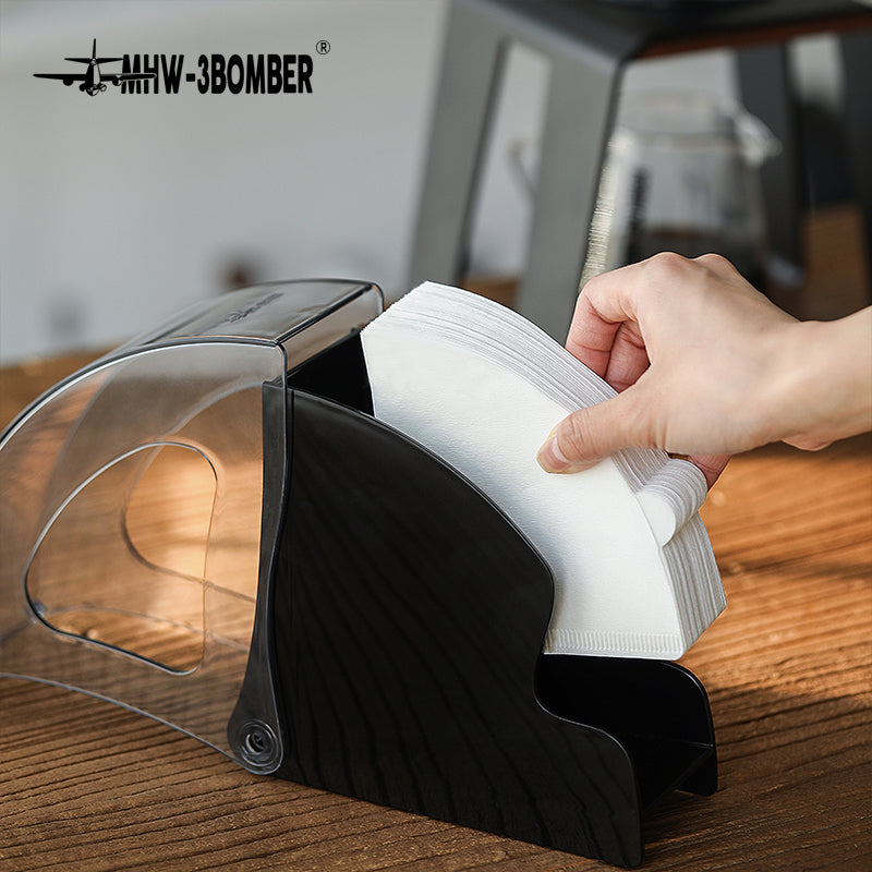 MHW-3BOMBER paper filters being placed in a black Snail holder; filters not included