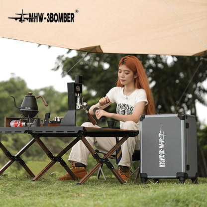 MHW-3BOMBER Sonic S7 CM801 machine and trolley case in an outdoor scene; table, stove and kettle are props