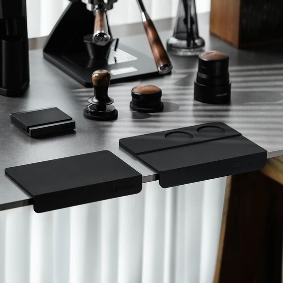 MHW-3BOMBER SP5309B black B-style tamping mat on the right; A-style mat and coffee tools shown for comparison and not included
