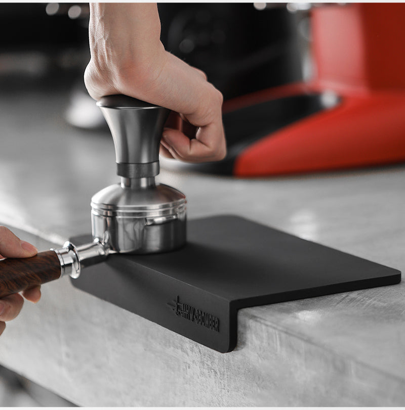 MHW-3BOMBER tamper used at the black flat A-style mat; tamper separate
