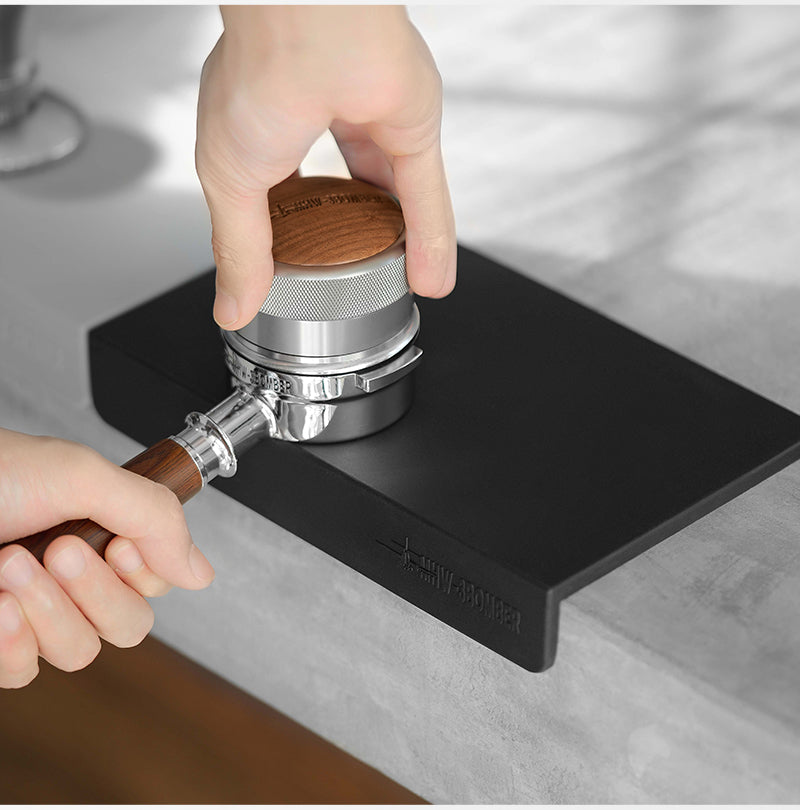 MHW-3BOMBER wood-topped tamper used at the black flat A-style mat; tamper separate